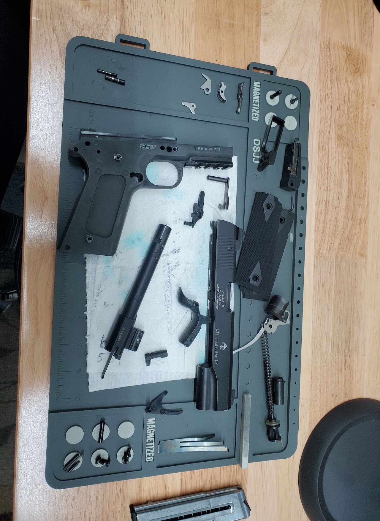 Gun Cleaning & Inspection — 1911 .22 laid out on the bench mat